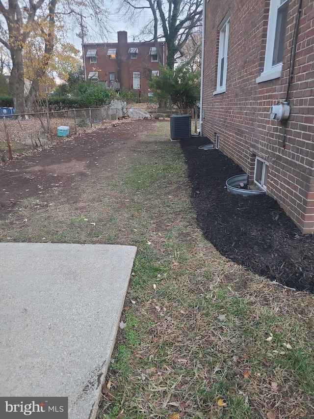 view of yard with central AC unit