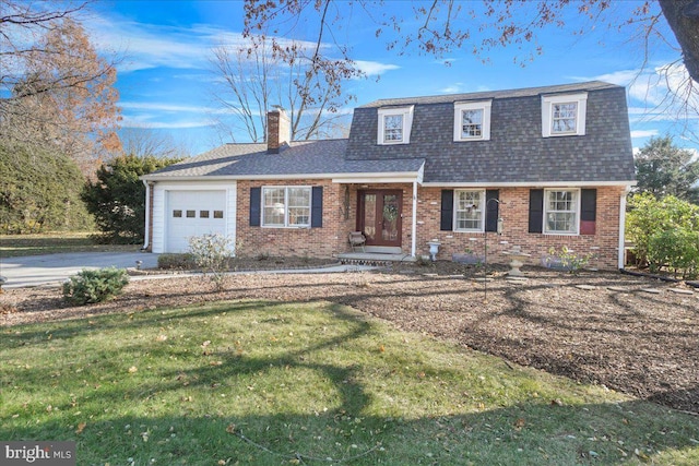 view of front property with a front yard and a garage