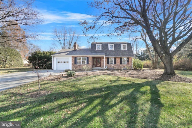 view of front of home featuring a garage and a front lawn