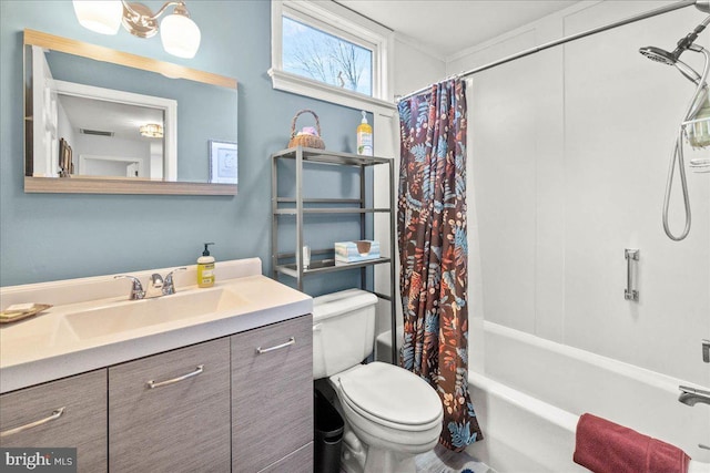 full bathroom with vanity, shower / bath combination with curtain, and toilet