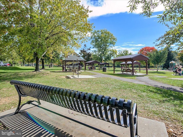 surrounding community with a gazebo and a yard