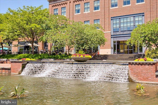 view of home's community with a water view