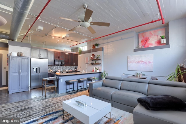 living room featuring ceiling fan