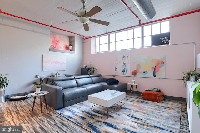 living room featuring hardwood / wood-style flooring and ceiling fan