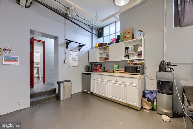 garage featuring stainless steel fridge