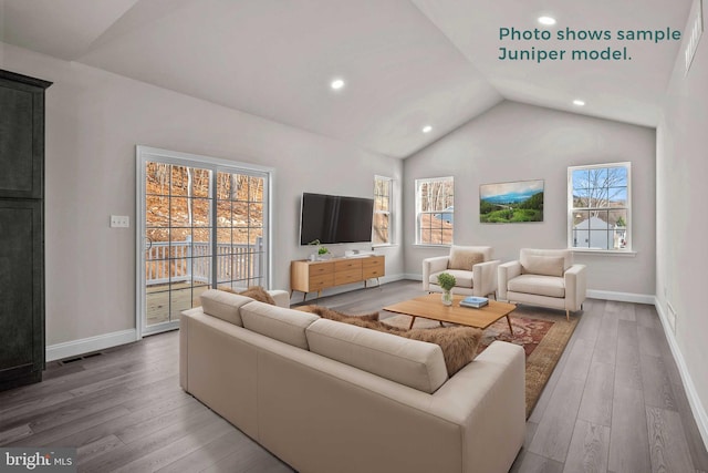 living area featuring lofted ceiling, baseboards, visible vents, and wood finished floors