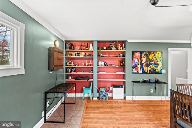 game room with crown molding and hardwood / wood-style flooring