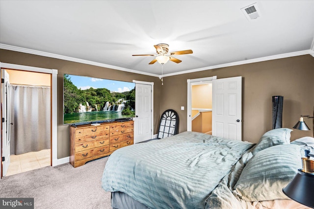 carpeted bedroom with ceiling fan and crown molding