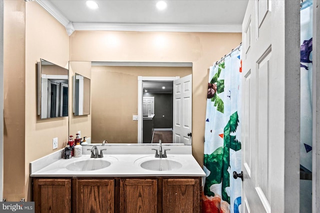 bathroom featuring crown molding and vanity