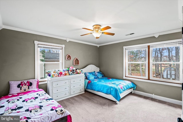 bedroom featuring multiple windows, ceiling fan, and light colored carpet