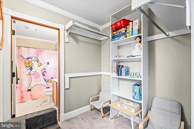 walk in closet featuring light colored carpet