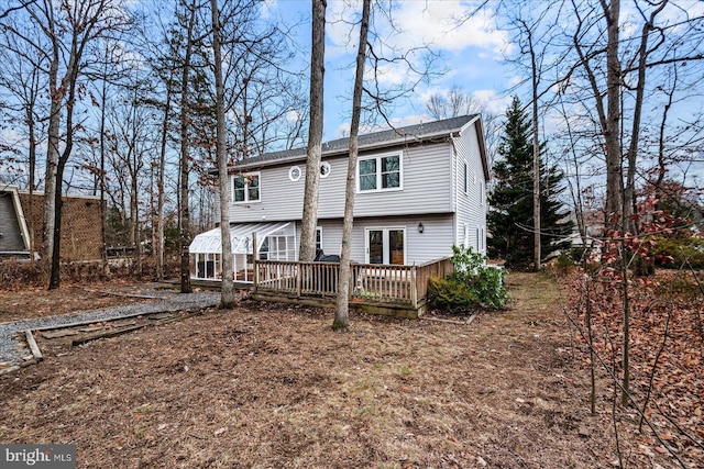 rear view of property with a deck