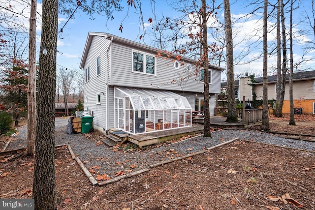 rear view of house with a sunroom