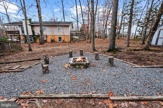 view of yard with a fire pit