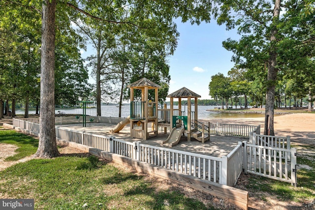 view of playground with a water view