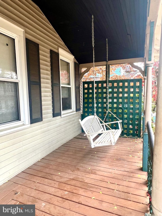 wooden deck featuring covered porch