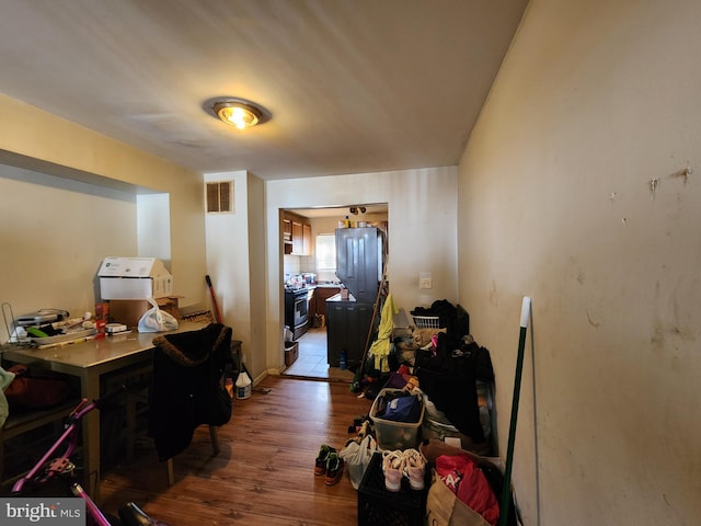 hall with dark wood-type flooring