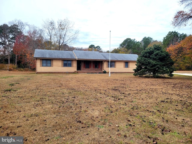 ranch-style home with a front yard