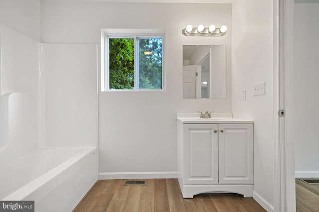 bathroom featuring vanity and hardwood / wood-style flooring