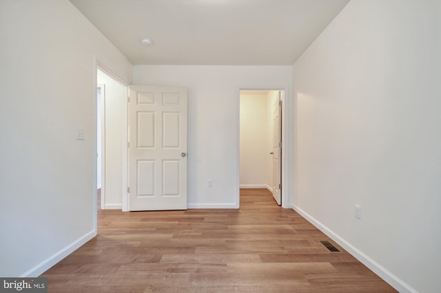 unfurnished bedroom with light wood-type flooring