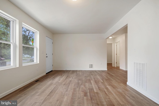 spare room featuring light wood-type flooring