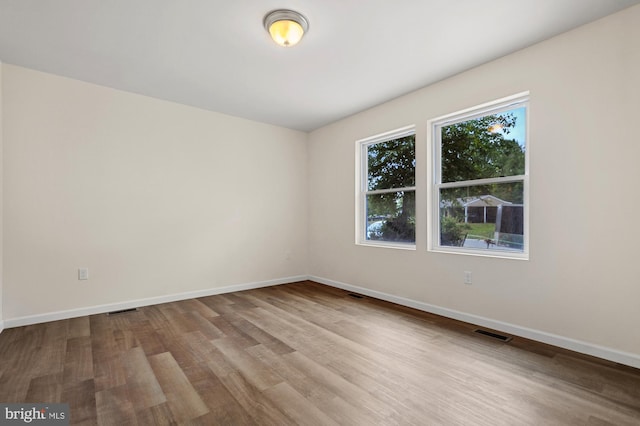 unfurnished room featuring light wood-type flooring