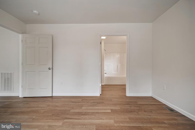 spare room with light wood-type flooring