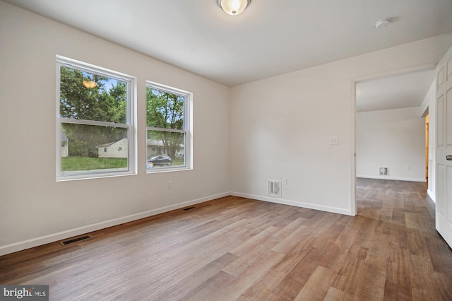 unfurnished room featuring light hardwood / wood-style flooring