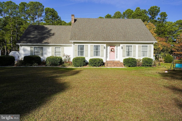 cape cod house featuring a front lawn