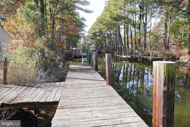 view of dock with a water view