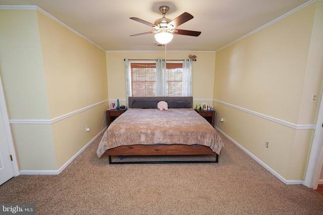 carpeted bedroom with ceiling fan and crown molding