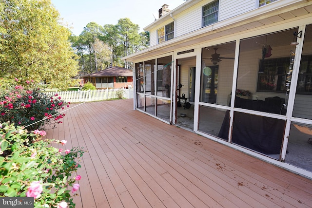 wooden deck featuring a sunroom