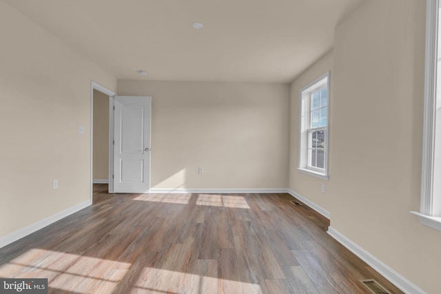 spare room featuring hardwood / wood-style floors