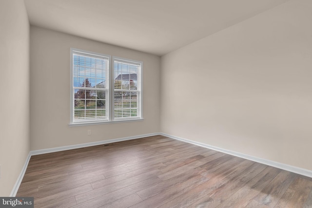 spare room with light wood-type flooring