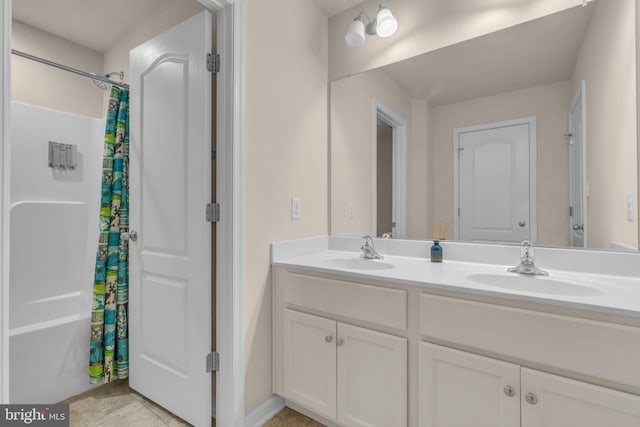 bathroom with vanity and shower / bath combo with shower curtain