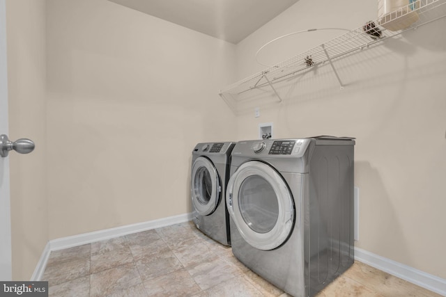 washroom with washer and clothes dryer