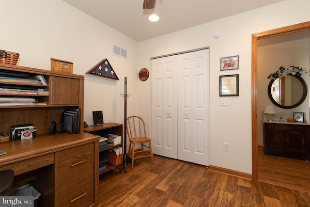 office space featuring dark hardwood / wood-style floors and ceiling fan