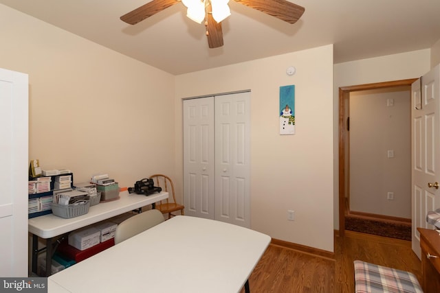 bedroom with ceiling fan, a closet, and hardwood / wood-style flooring