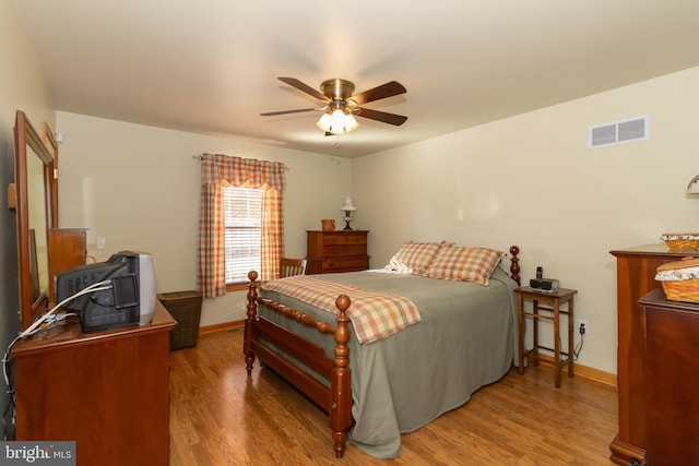 bedroom featuring ceiling fan and light hardwood / wood-style flooring