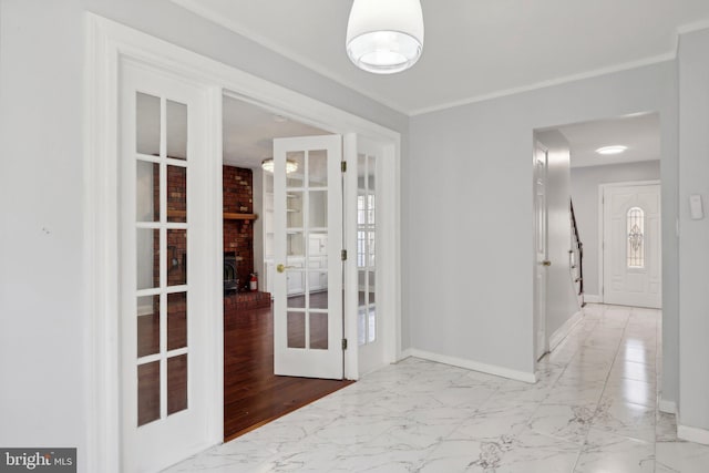 corridor with french doors and light hardwood / wood-style flooring