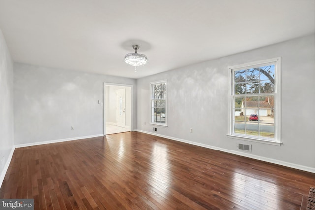 empty room with hardwood / wood-style floors