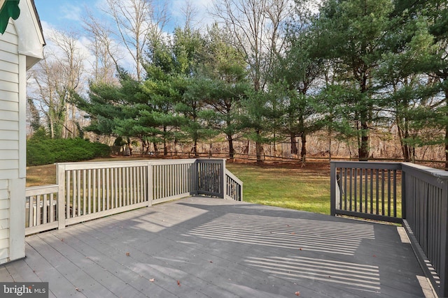 deck featuring a lawn