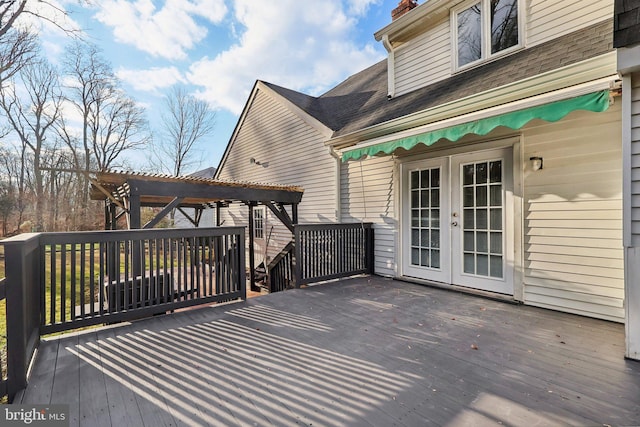 deck featuring french doors and a pergola