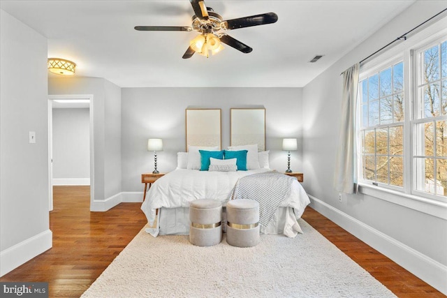 bedroom with hardwood / wood-style flooring and ceiling fan