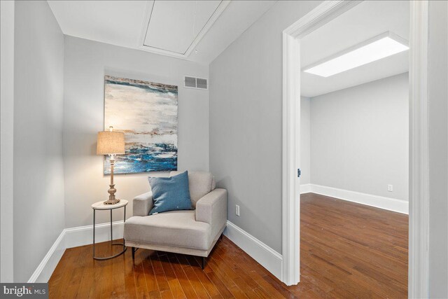 sitting room featuring wood-type flooring