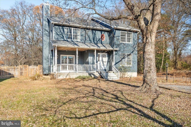 view of front of home featuring a front yard and a porch