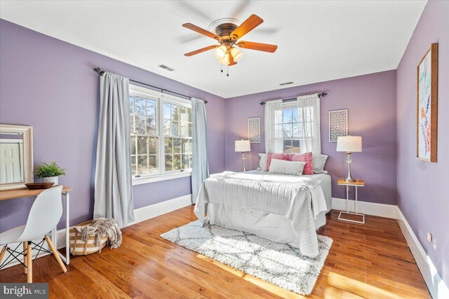 bedroom featuring ceiling fan and light hardwood / wood-style floors