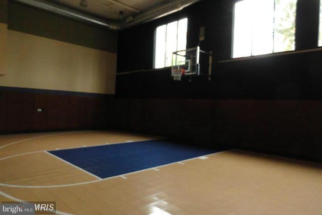 view of basketball court featuring plenty of natural light