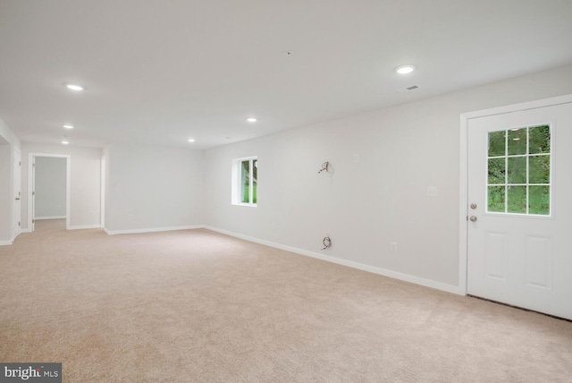 carpeted spare room with a wealth of natural light