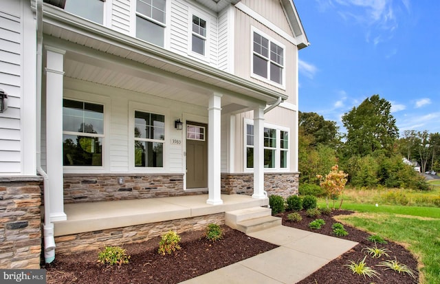 entrance to property featuring covered porch